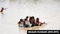 People affected by flooding wait for relief in in Pakistan's Sindh Province on August 28. 