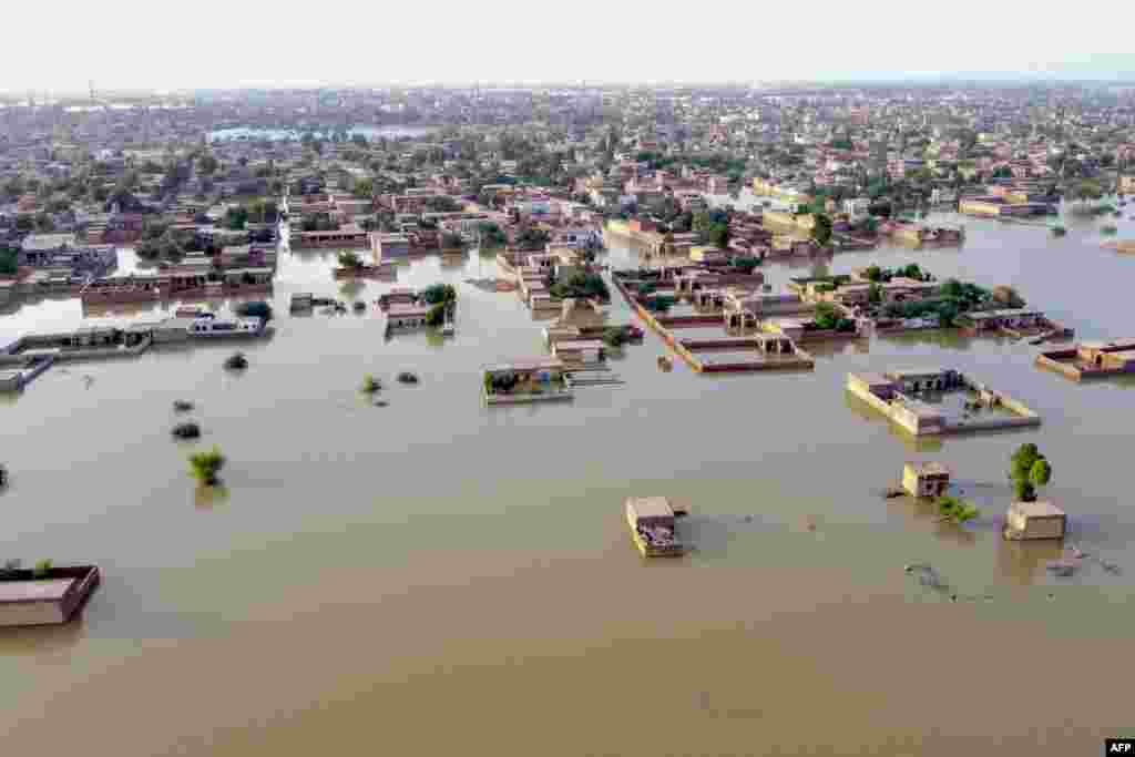 An aerial view shows a flooded residential area in Balochistan Province on August 29. Pakistan&#39;s economy is still reeling from the floods of 2022, which inflicted unprecedented damage to the country. More than 33 million people were affected by the floodwaters, which left more than 8 million people homeless and caused more than $30 billion in damages and economic loss. According to authorities, thousands of flood victims continue to live out in the open.