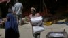 A man carries a sack of wheat flour imported from Turkey in Mogadishu, Somalia, Thursday.