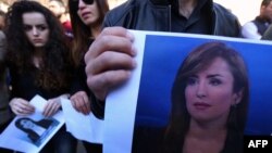 Students of Irbil's College of Journalism hold portraits of Shifa Gardi, a journalist for the network Rudaw who was killed while covering the Mosul offensive, during a memorial ceremony in Irbil on February 26.