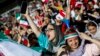 Iranian female soccer supporters were given a rare opportunity to cheer their team on at a special live transmission in Tehran of their country's World Cup game with Spain on June 20. 