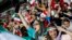 Iranian women cheer their World Cup soccer team at Tehran's Azadi stadium on June 20.