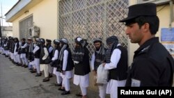 Afghan prisoners line up at the Pul-e Charkhi prison (file photo)