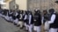 Prisoners line up at the Pul-e Charkhi prison after their release in Kabul on January 11.