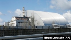 A shelter construction covers the exploded reactor at the Chernobyl nuclear plant.