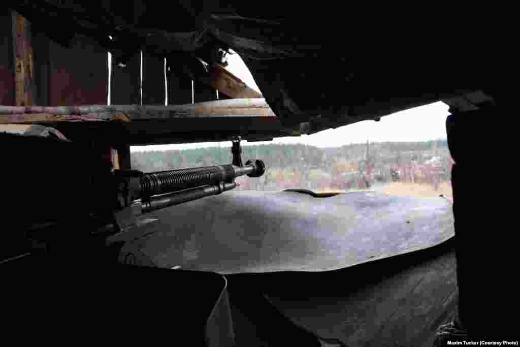 &nbsp;A view of separatist positions from a heavy machine-gun emplacement in the town of Mariyinka, 27 kilometers south of Avdiyivka. Tucker says advances by the two sides have brought them as close as 300 meters to each other. Ukraine&#39;s 14th Mechanized Brigade, stationed in Mariyinka, comes under nightly fire from rocket-propelled grenades, snipers, and machine guns. April 4, 2016