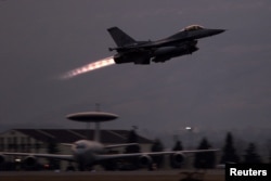 A U.S. F-16 fighter jet takes off from NATO's Aviano Air Base in Italy on March 24, 1999, for a mission targeting Yugoslav military positions in Kosovo.