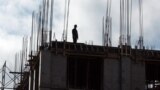 Skopje - Macedonia - Worker standing on top of a building in construction