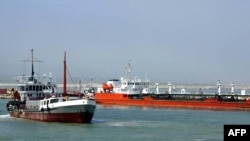 An Iranian oil tanker is seen floating on the Caspian Sea, as Iranian President Mohammad Khatami attends the opening ceremony 29 April 2004, of the Neka oil terminal on the Caspian Sea