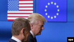 U.S. President Donald Trump (R) walks with the President of the European Council Donald Tusk in Brussels, May 25, 2017