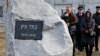 UKRAINE -- People attend a foundation stone laying ceremony for a future memorial site to the people killed in a plane shot down in Iran in January, at the Boryspil International Airport outside Kyiv, February, 17, 2020