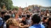 A group of protesters chant slogans at the main gate of old grand bazaar in Tehran, Iran, Monday, June 25, 2018. Protesters in the Iranian capital swarmed its historic Grand Bazaar on Monday, news agencies reported, and forced shopkeepers to close
