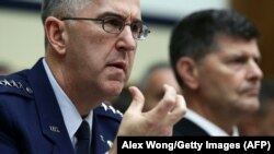 General John Hyten (left) testifies during a hearing before the House Armed Services Committee in March 2017 in Washington, D.C.