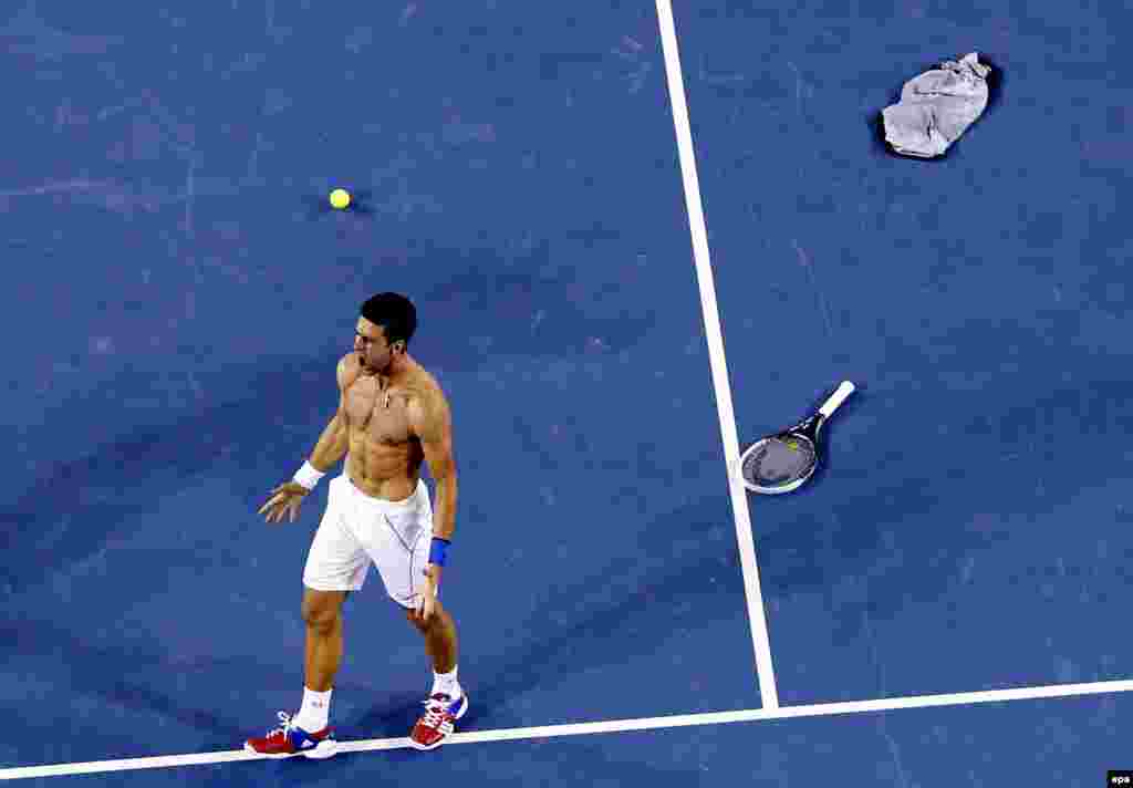 Novak Djokovic of Serbia celebrates after winning the men's singles final against Rafael Nadal of Spain at the Australian Open tennis tournament in Melbourne, Australia, on January 30. (epa/Masr Irham)
