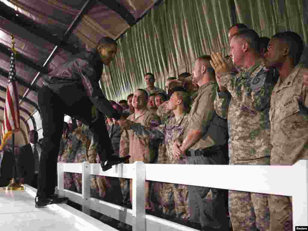 U.S. President Barack Obama meets with troops at Bagram Air Base in Kabul on March 28. - President Obama arrived unannounced in Afghanistan on March 28, his first visit to the war zone that could define his presidency since his election as U.S. commander in chief. Photo by Jim Young for Reuters