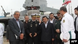 Iranian President Mahmud Ahmadinejad (center) attended the inauguration of the "Jamaran-2" guided-missile destroyer in the port city of Anzali on March 17.