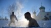 A man takes a dip in the settlement of Moskalenki in Russia&#39;s Omsk region.