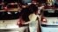 Iran -- Two protesters kiss each other in Shiraz