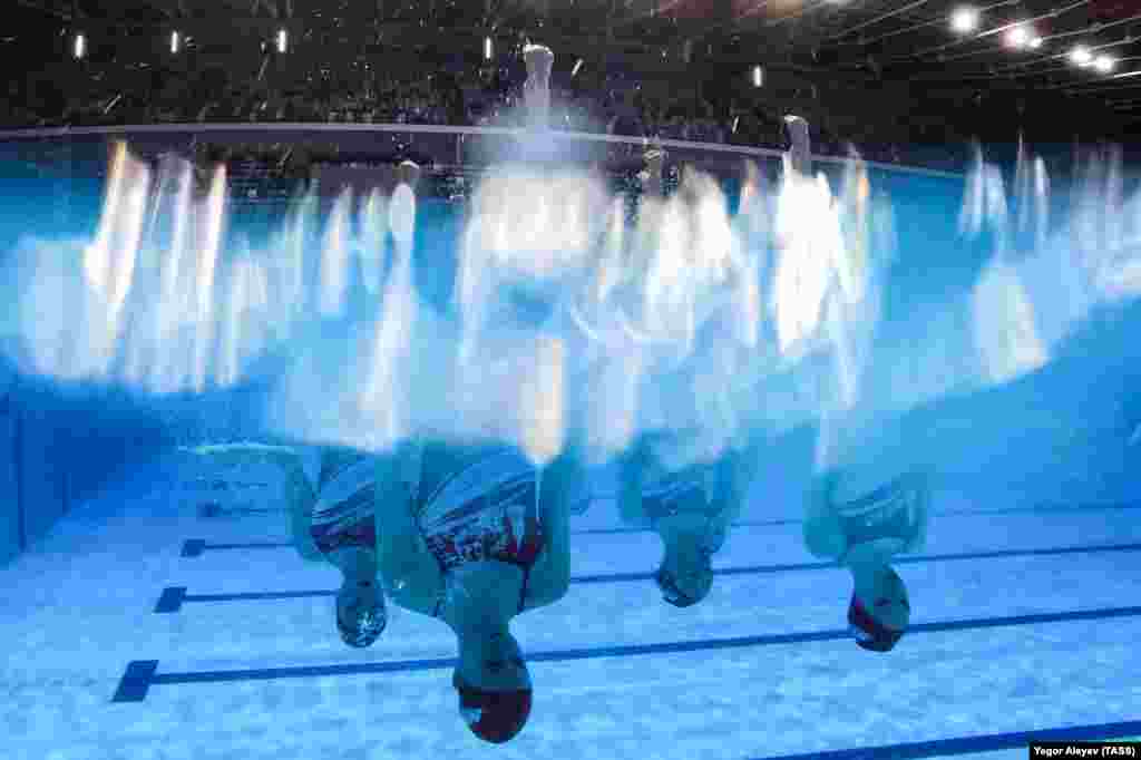 Team Moscow 1 practices before competing in the women&#39;s team technical event at the 2022 Russian Synchronized Swimming Championships at the Palace of Water Sports in Kazan, Tatarstan.