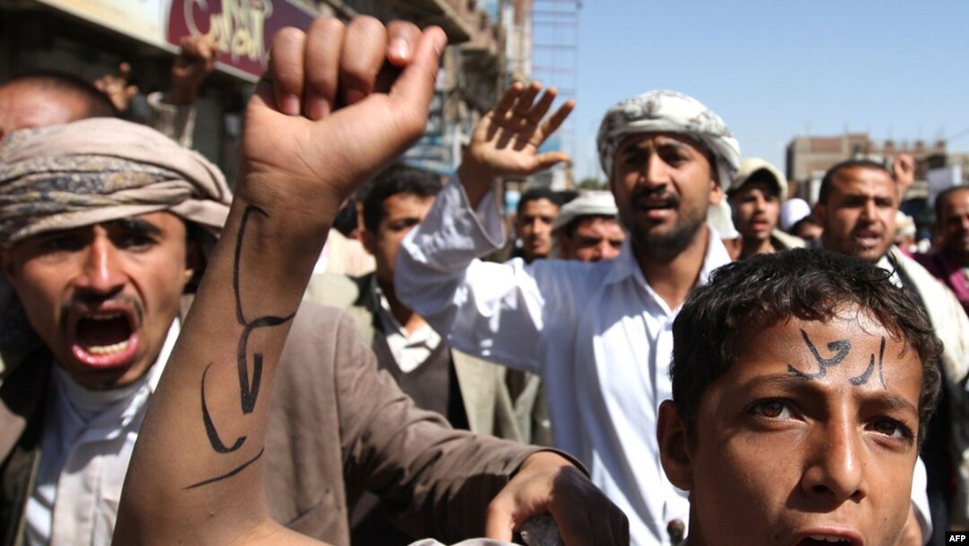 A young Yemeni protester with the word "Leave" written across his forehead at an antigovernment demonstration in the capital, Sanaa, on February 23