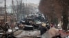 The gutted remains of Russian military vehicles on a road in the town of Bucha, close to the capital, Kyiv, on March 1.