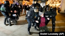 Riot police detain demonstrators during a protest in St. Petersburg against Russia's war on Ukraine. For years, rights groups have sought to track the abuse and torture of detainees by Russian security forces and a new surreptitious recording seems to convey in painful detail how police interrogations are frequently conducted. 