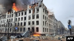UKRAINE - Firefighters extinguish a fire in the regional police department building in Kharkiv hit by recent shelling, March 2, 2022.