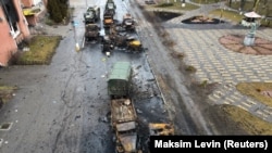 Destroyed Russian military vehicles are seen on a street in the settlement of Borodyanka, in the Kyiv region, on March 3.