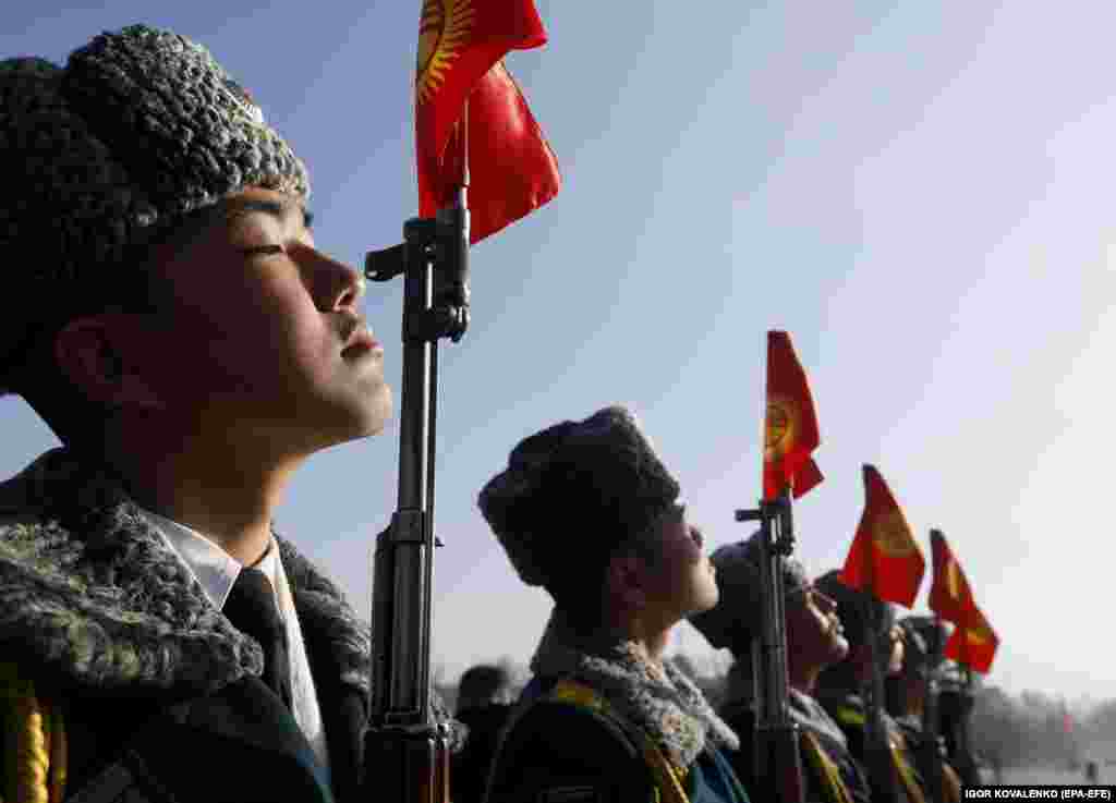 Kyrgyz soldiers soldiers take part in a procession dedicated to the Day of the State Flag in Bishkek on March 3.&nbsp;