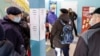 People wait in line at a currency exchange office in Kaliningrad, where residents are nervously watching the unfolding political situation surrounding Ukraine and the alarming collapse of the ruble.