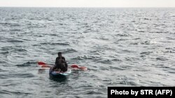 File Photo : Three migrants who were attempting to cross The English Channel from France(AFP)