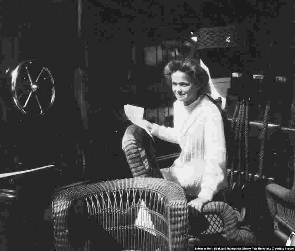 Olga Romanov in a wicker chair aboard the Standart