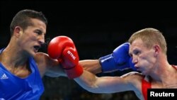 Серебряный призер чемпионата Европы Николай Буценко (справа) на Олимпиаде 2016 года в Рио-де-Жанейро