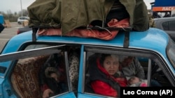 People fleeing the fighting in Mariupol and nearby towns arrive at a refugee center in Zaporizhzhya on April 21.