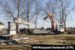 An obelisk memorializing the Red Army is toppled in Chrzowice, southwestern Poland, on March 23.