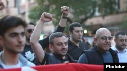 Armenia - Deputy parliament speaker Ishkhan Saghatelian (second from left) leads an opposition protest in Yerevan, April 27, 2022.