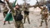 Российские военные из чеченского батальона «Ахмат» в украинском Мариуполе, 17 апреля 2022 года