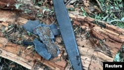 Fragments of a Russian Geran 1/2 drone lie on the ground in a location given as near the village of Plauru in Romania on July 25.