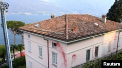A villa owned by Russian TV presenter Vladimir Solovyov is seen splashed with red paint after being vandalized in Pianello del Lario, near Lake Como, Italy, on April 6, 2022. 