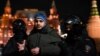 Police detain a man during a protest against Russia's invasion of Ukraine in central Moscow on March 2.