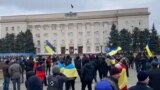 Ukrainians Wave Flags At Protest In City Seized By Russian Forces Screen grab