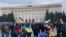 Ukrainians Wave Flags At Protest In City Seized By Russian Forces Screen grab