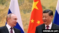 Președintele chinez Xi Jinping, dreapta, și președintele Federației Ruse, Vladimir Putin