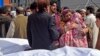 Family members mourn the death of their relatives outside a hospital following a bomb blast at a mosque in Peshawar on March 4.
