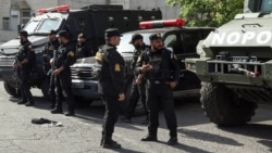 Security forces are seen outside the Tehran's Grand Mosalla prayer complex as mourners arrive for funeral ceremonies for Iran's late supreme leader, Ayatollah Ali Khamenei on July 4. 