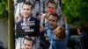 هواداران مکرون در حال نصب پوسترهای تبلیغاتی او در سطح شهر، در آستانه دور دوم انتخابات فرانسه