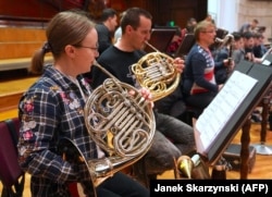 The brass section of the orchestra rehearsing in Warsaw on April 19.
