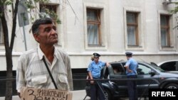 Some Crimean Tatars, like this man protesting outside a presidential administrative building in early July, insist that serious grievances are not being addressed.