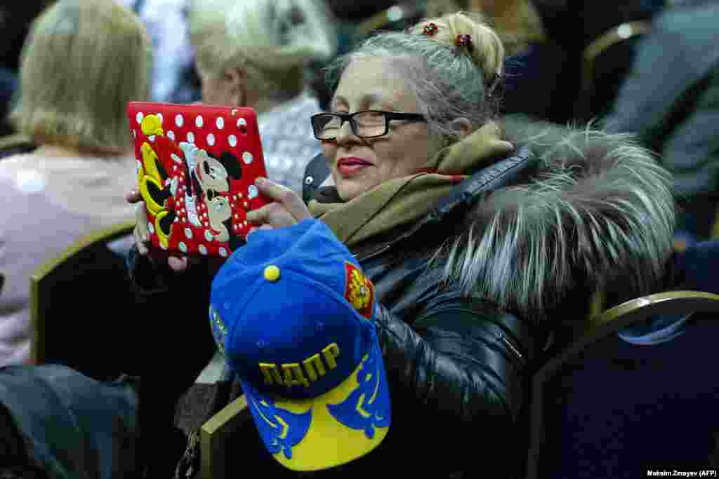 Supporters of the nationalist Liberal Democratic Party of Russia attend a meeting with the party&#39;s leader and presidential candidate, Vladimir Zhirinovsky, outside Moscow on March 8. (AFP/Maxim Zmeyev)