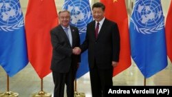 Chinese President Xi Jinping shakes hands with UN Secretary-General Antonio Guterres before their talks in Beijing on April 26.